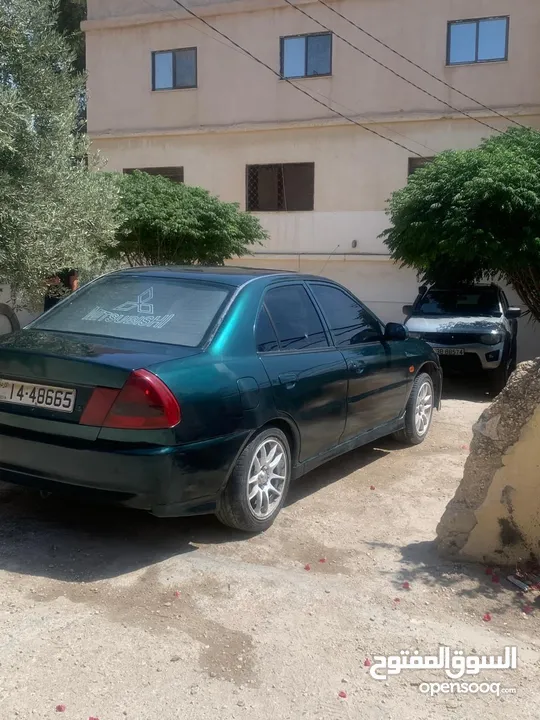 متسوبيشي لانسر 1997 موجوده في جرش في مجال للتفاوض بشي بسيط