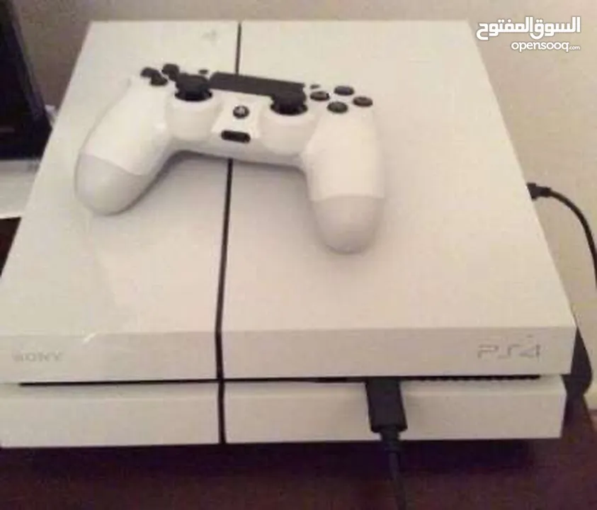 White Playstation 4 with two controllers