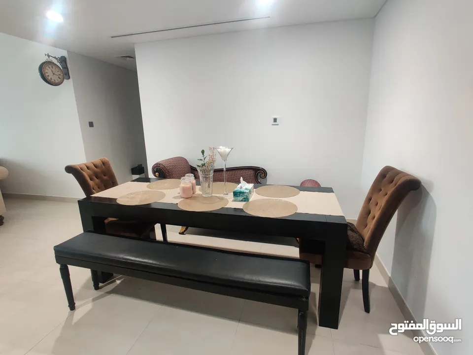 Dining table (The ONE), benches, chairs (Marina) for AED 800.