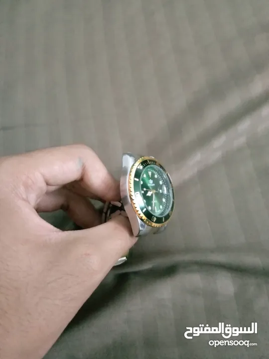 ساعه شبيهه برولكس بمواصفات عاليه لون اخضر