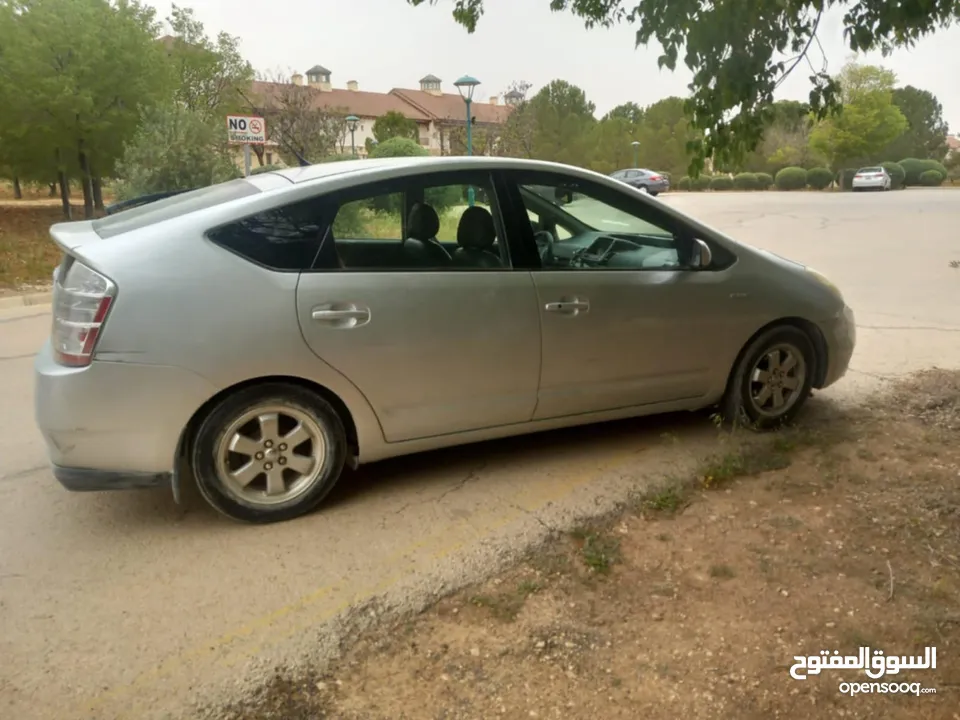 ويوتا بريوس 2007 الفحص مرفق مع الصور بطارية هايبرد جديد الوكاله جير جديد abs جديد بواجي وكوابل جديد