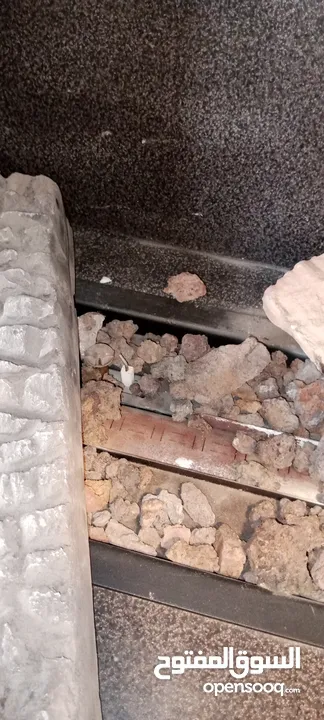 مدفأة  فير بليس  لون بني مع ديكور  مجسم على حجم الحائط واجهه كامله تعمل على جره الغاز
