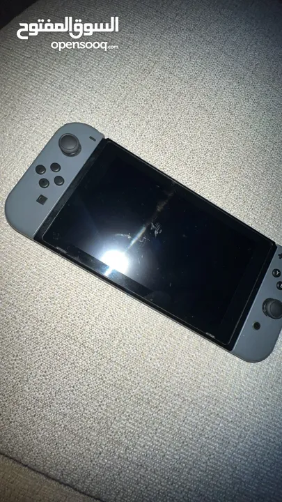 Nintendo switch! With game! Has some scratches and a crack.