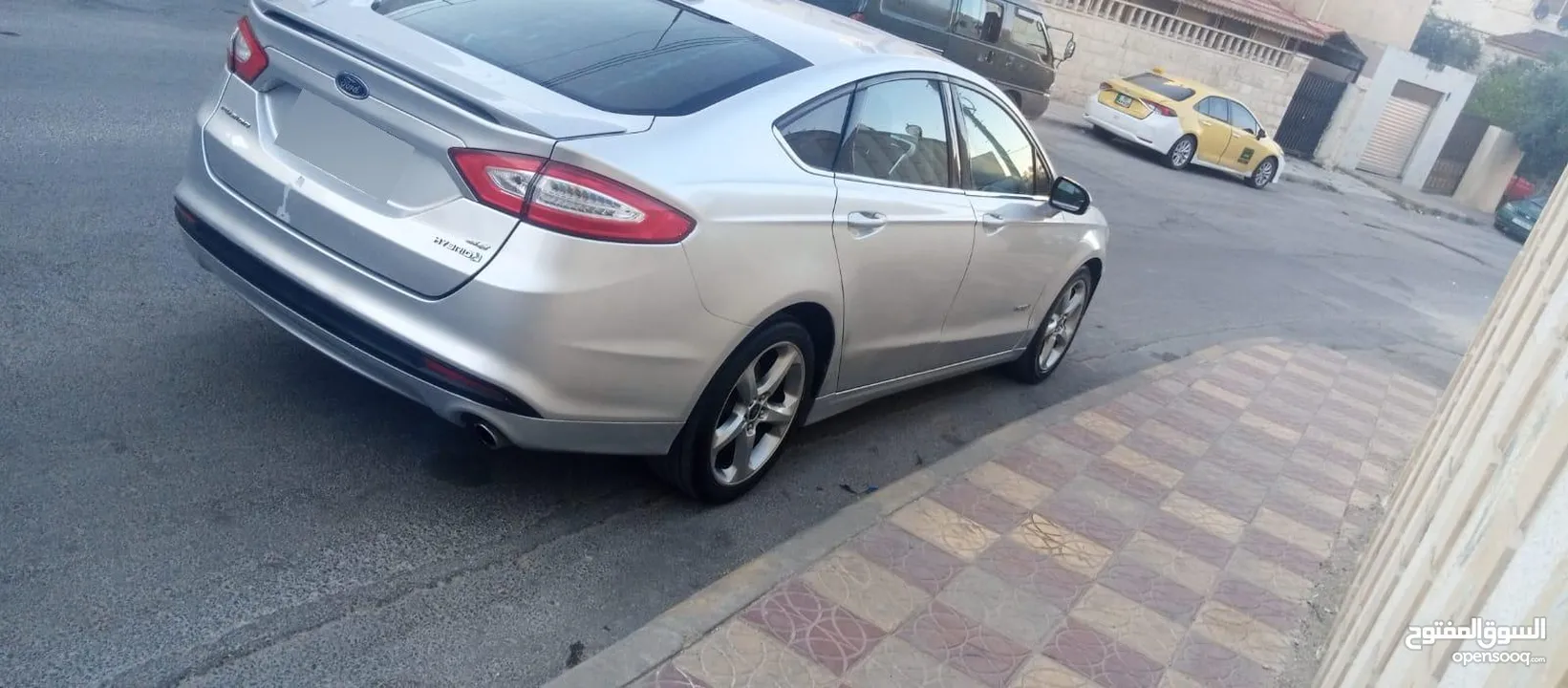 فورد فيوجن 2014 هايبرد كلين فحص كامل لون سلفر بحالة الوكالة