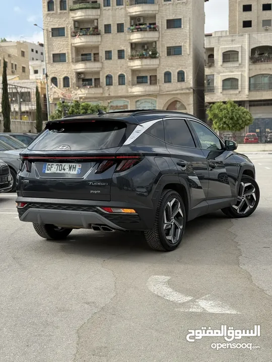 هونداي توسان ترخيص 2022 محرك 1600 هايبرد plug in/يقطع على الشحنه 65 كيلو متر