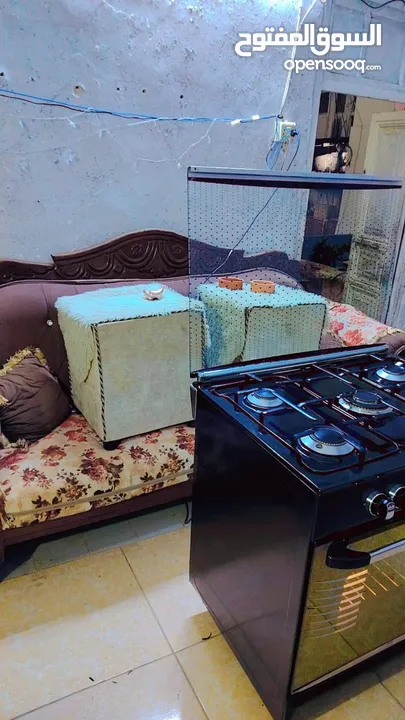 غازي يونيفرسال ايطالي لون اسود 80سم مجدد بالكامل كهرباء الفرن شغاله نار زرقاء للطهي يوجد كفاله تهري