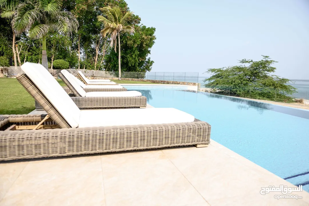 Luxurious 5BR beachfront Villa with private pool and Marina access available for Sale in Jebel Sifah