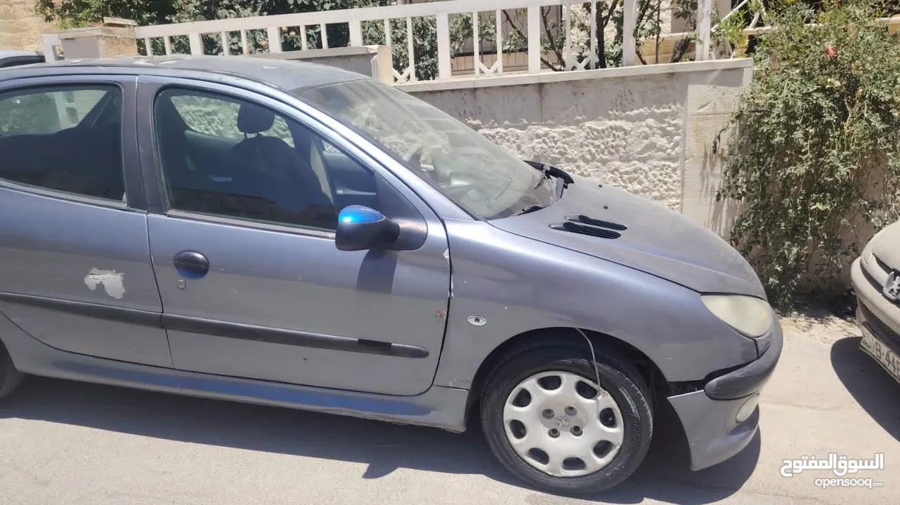 بيجو 2007 موديل 206 فحص كوم حديد 1300دينار