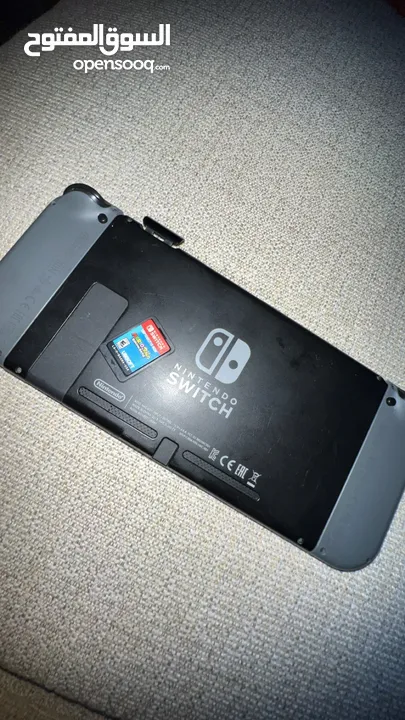 Nintendo switch! With game! Has some scratches and a crack.