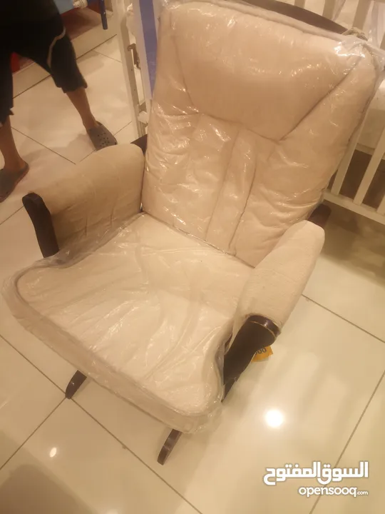 Rocking chair with moving sitting pad