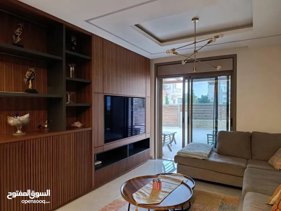 شقه للبيع مع حديقه في المصيون خلف البنك العربي