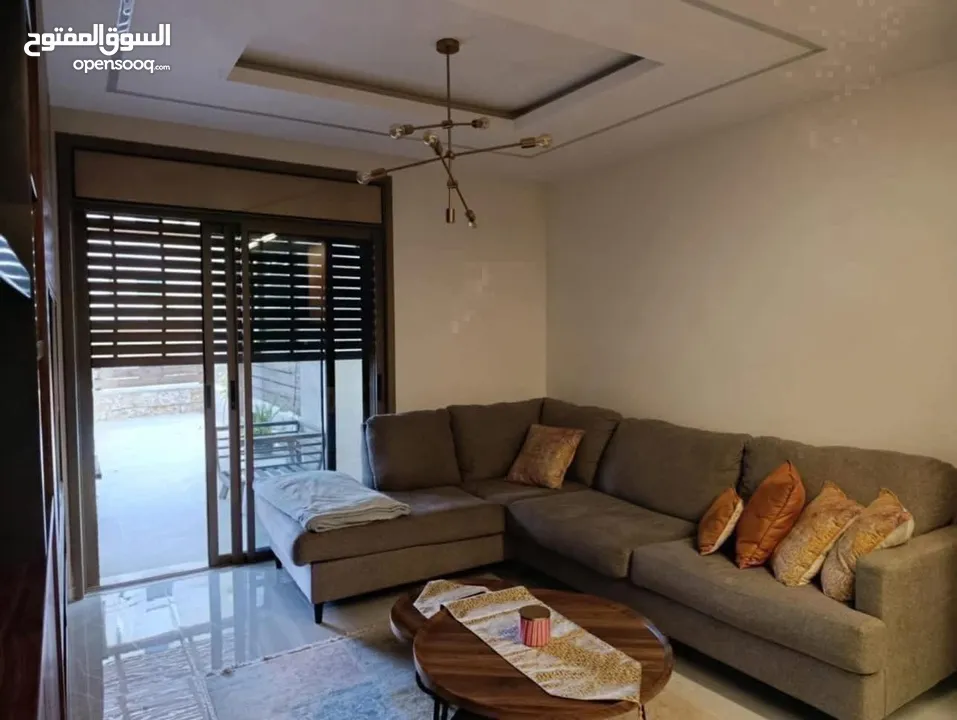 شقه للبيع مع حديقه في المصيون قرب البنك العربي