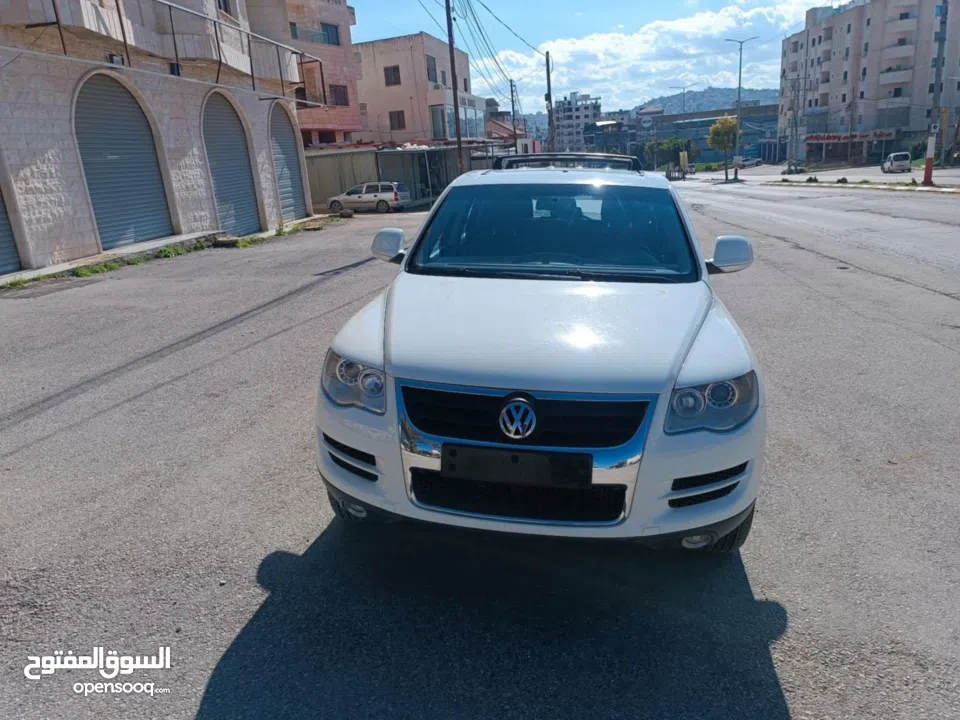 فولكس فاجن طوارق 2008 بحالة الوكالة  ماتور ديزل 3000 V6 عداد 145000 جير و ماتور و شصيات 100% وعلى ال