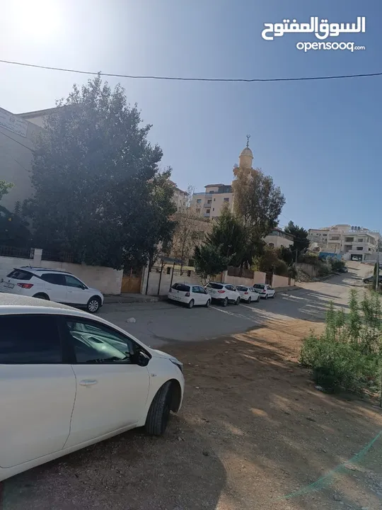 قطعة ارض بالقرب من جامع الزاوياني على شارع 12 متر