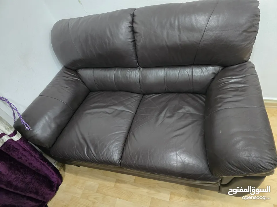 Sofa leather 2 seater in good conditions 25 kd table wooden 10 kd