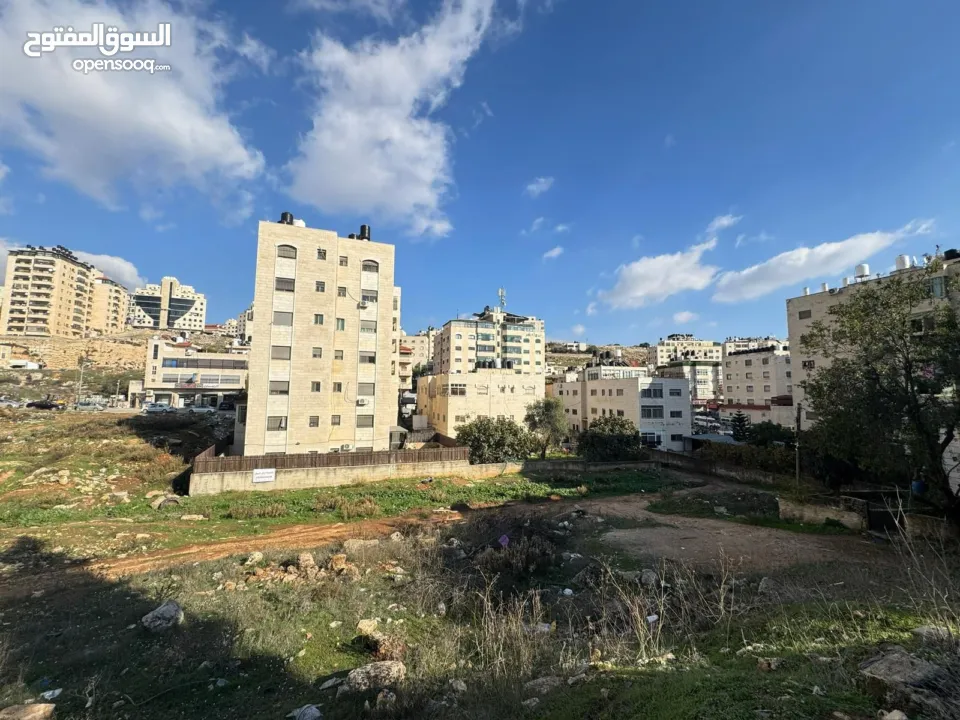 ارض للبيع في ام الشرايط بالقرب من الشارع الرئيسي