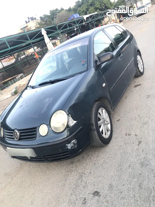 polo 2003  اللون الزيتي