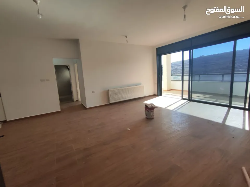 شقة قيد الفرش للإيجار – عين منجد / شارع إسكان المهندسين