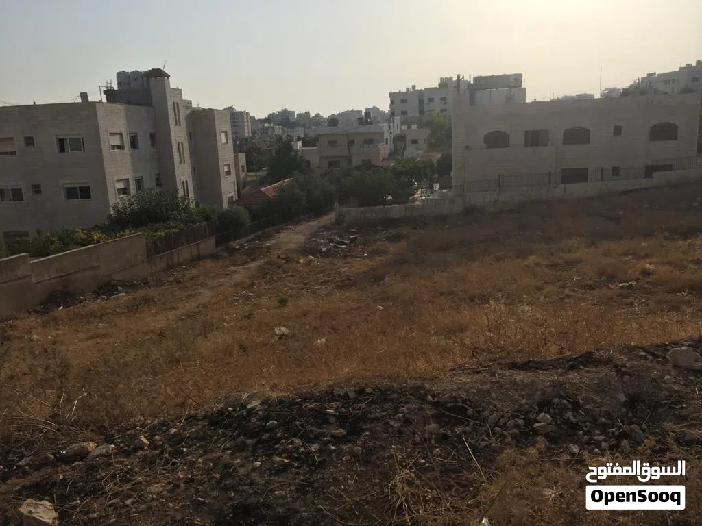 قطعة ارض على طريق المطار خلف المدارس العالمية