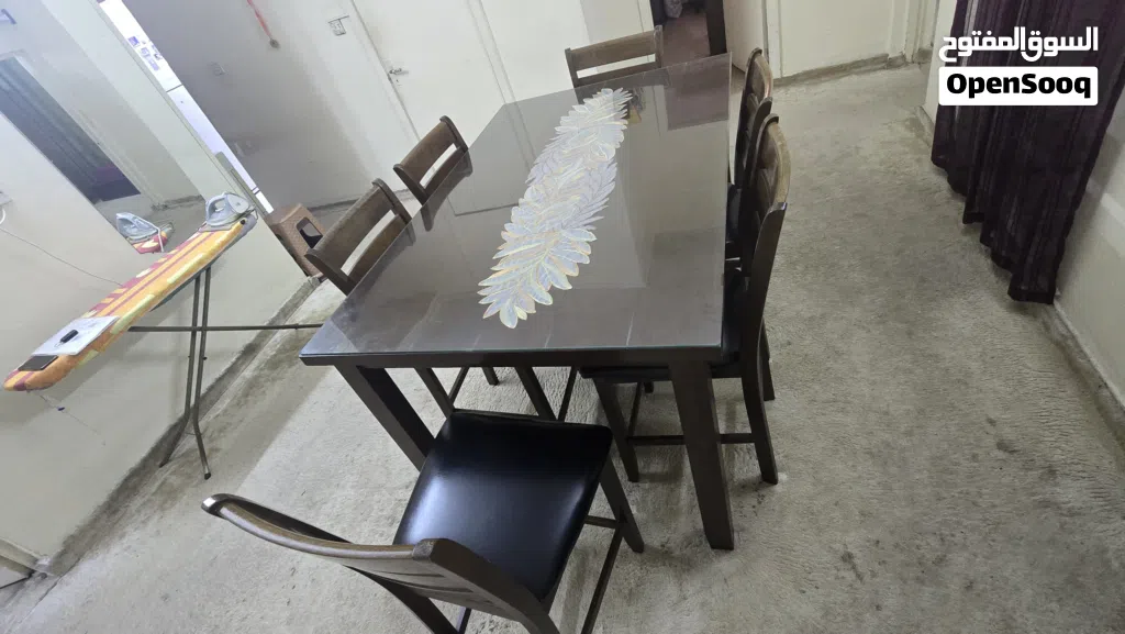 Dining table with 6 leather seated chairs.