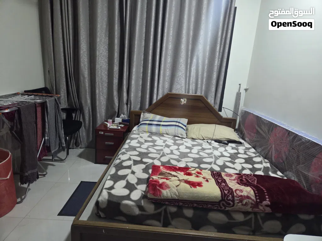 Bed with maters, cupboard, washing machine, small Fridge, TV with dish & setup box