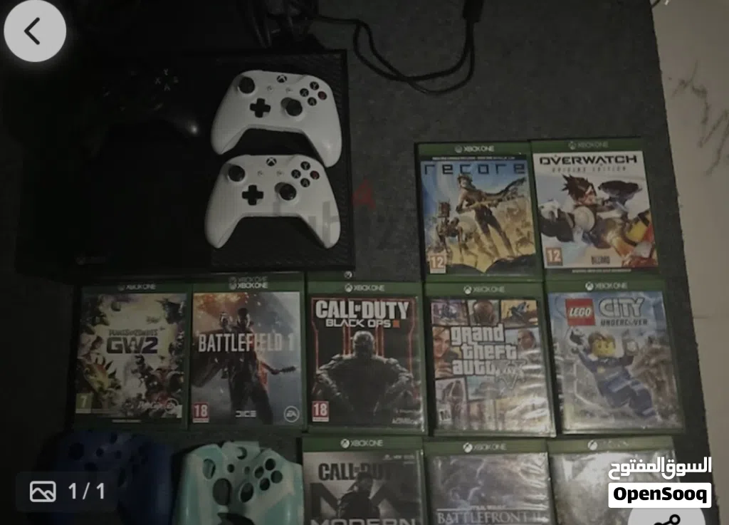xbox one console + 3 controllers + 10 good as new cds + 2 controller cover...