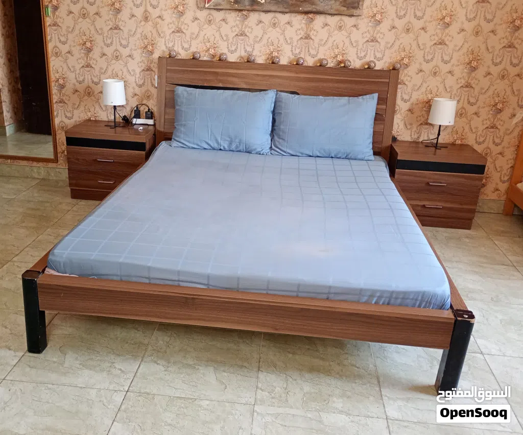 bed with mattress and side tables