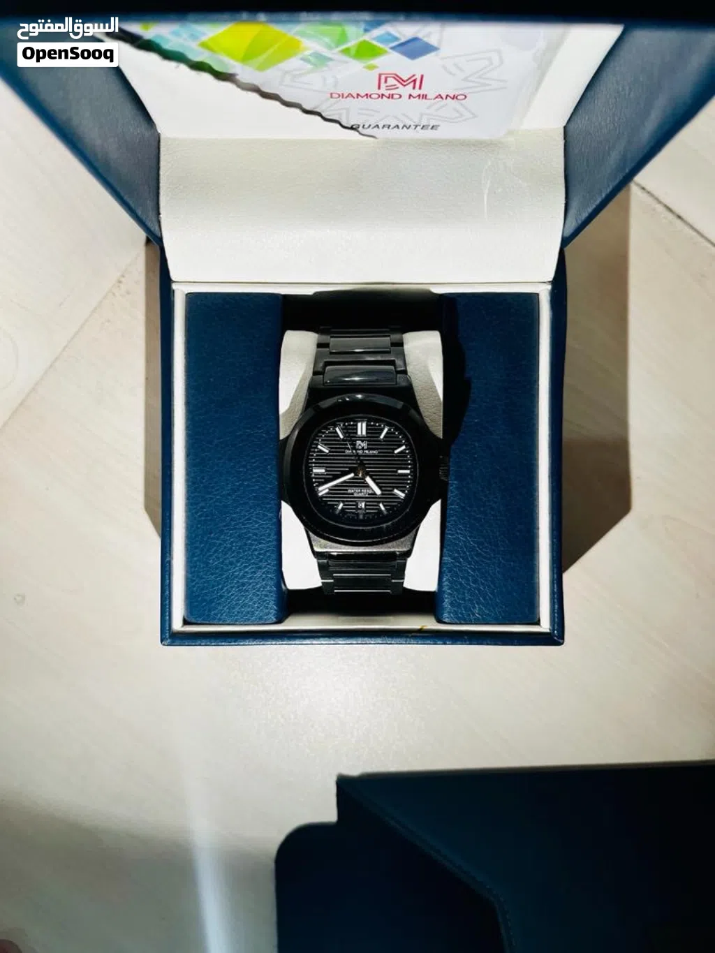 Diamond Milanese watch, luxurious black color.