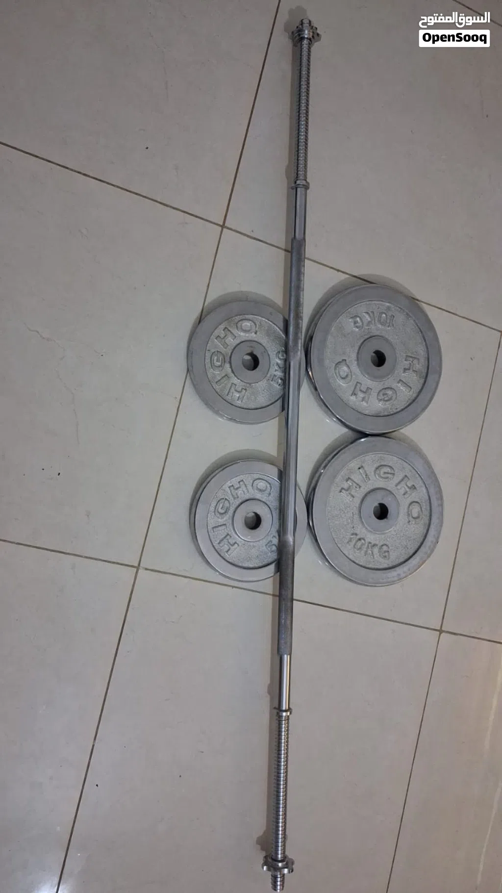 بار طويل مع أوزان عشره وخمسه كغم