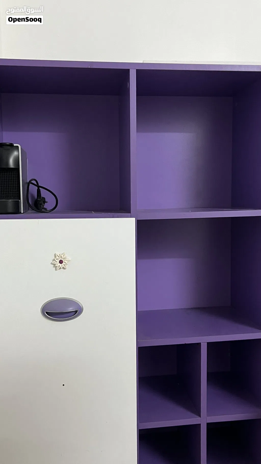 Purple wooden shelvesأرفف/مكتبة خشبية بنفسجيه