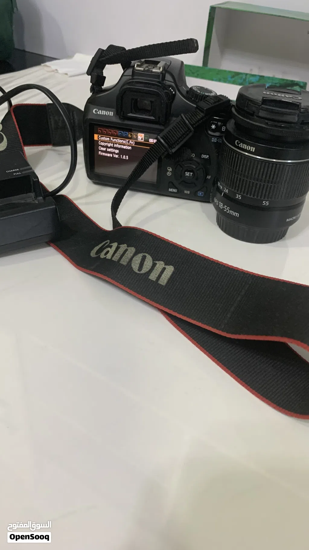 Canon EOS DSLR 1100 with 18-55mm Kit Lens, strap and charger Shutter Counter): 11,355)
