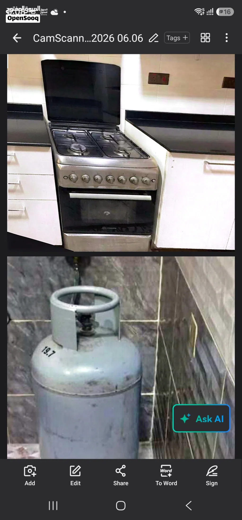 4-burner gas stove with an oven and a gas cylinder.