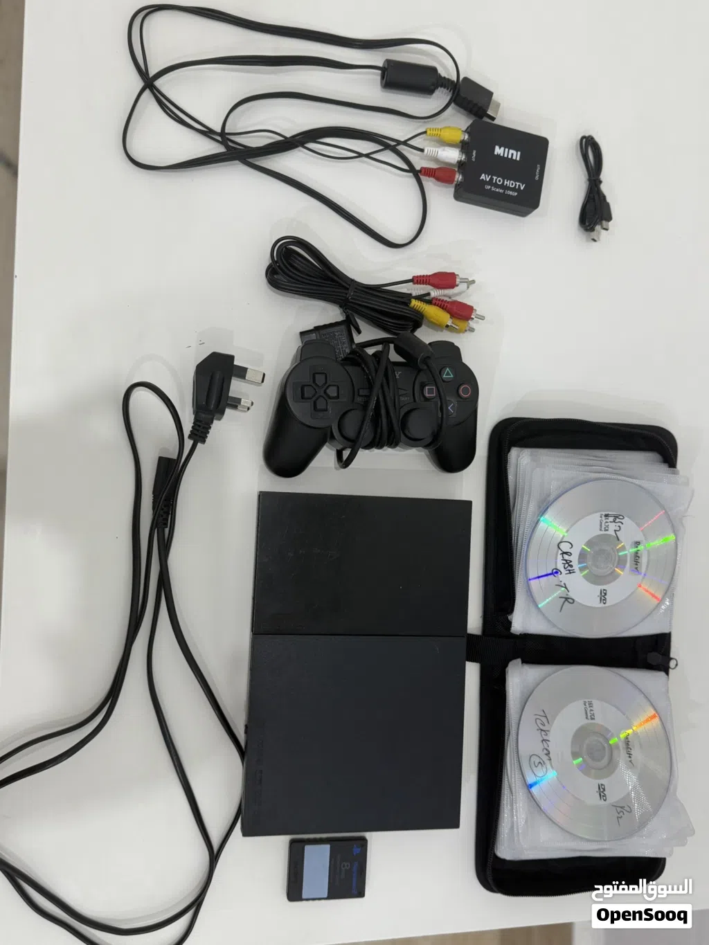 جهاز بلايستيشن 2 مستعمل مع يد تحكم و ميموري 8MB مع 34 شريط وحافظة أشرطة مع منفذ محول من AV الى hdmi