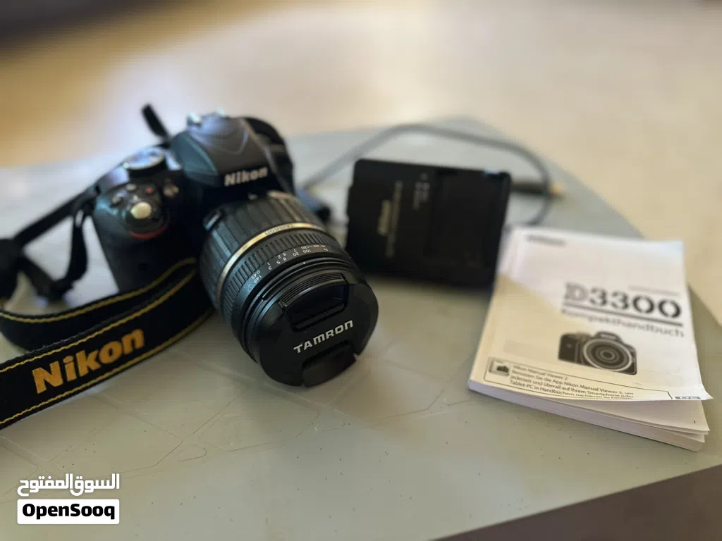 نيكون D3300 بحالة الوكاله مع عدسه TAMRON