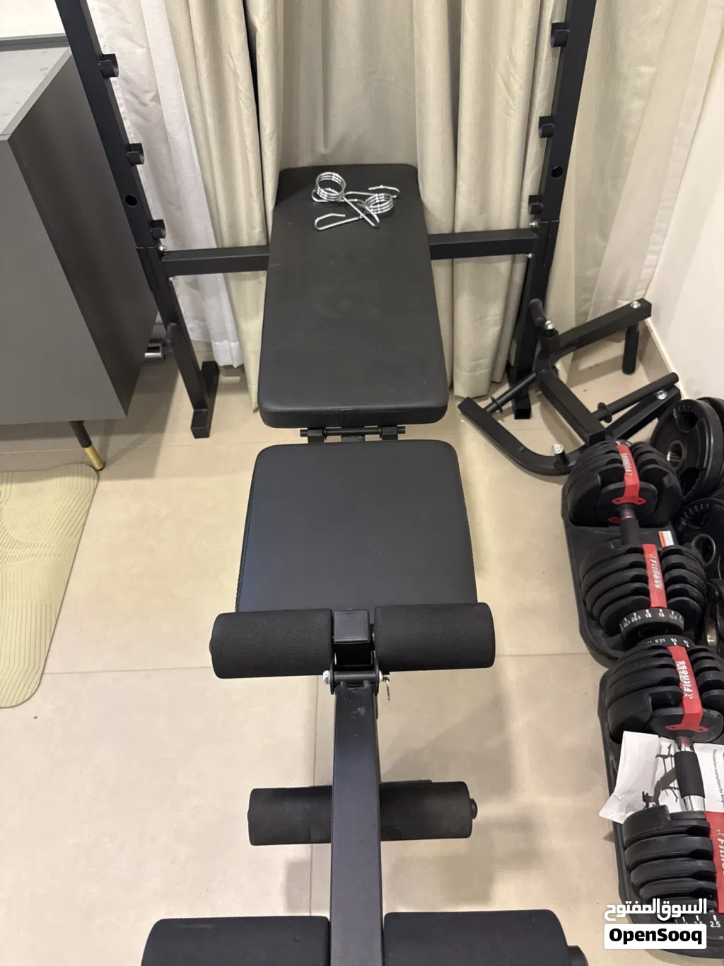 Dumbbells, bench and bar with weights