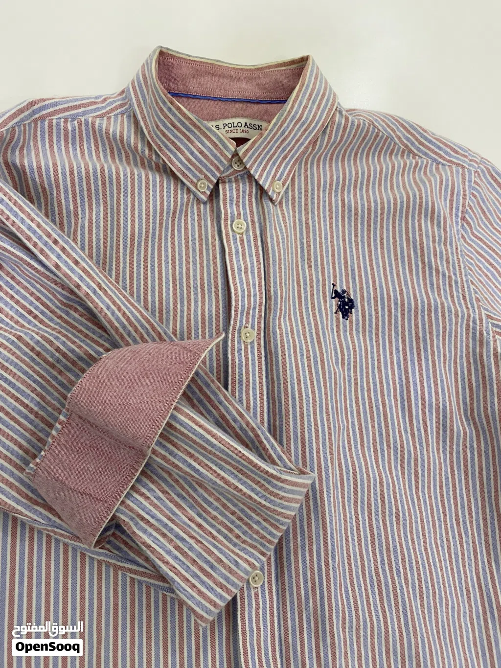 قمصان polo