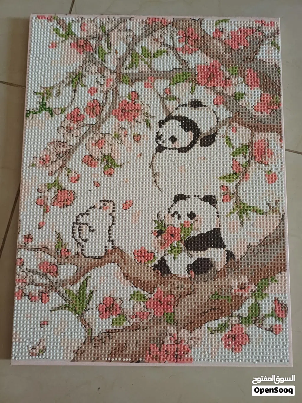 Cute panda painting with dots filled in by hand