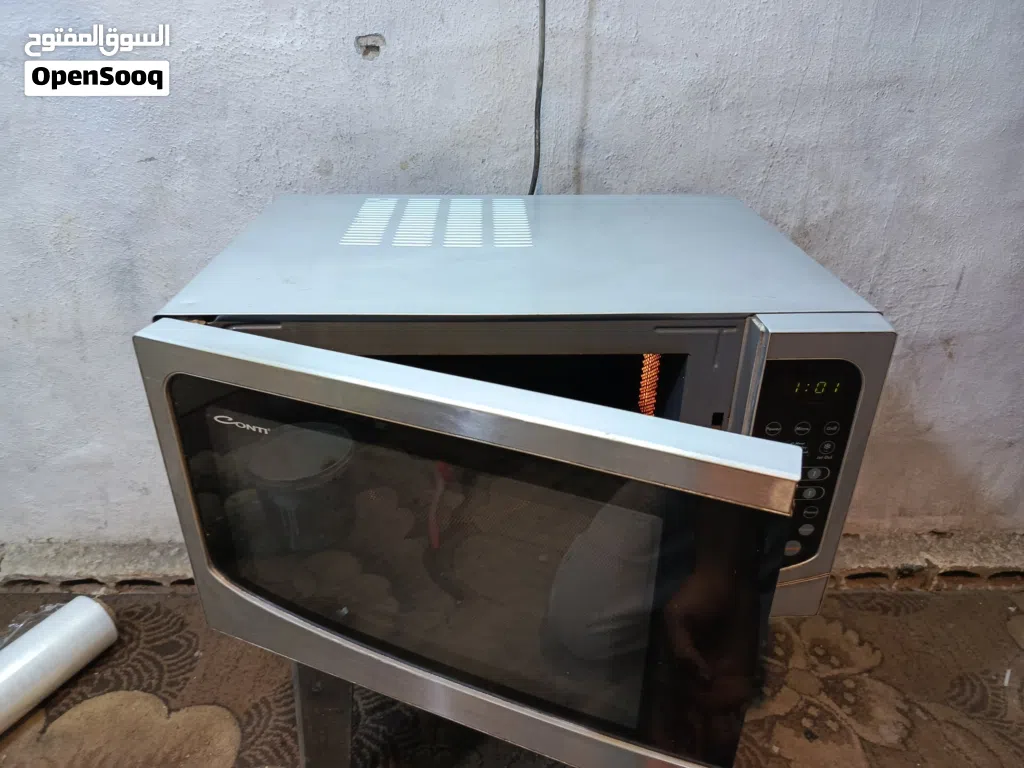 ميكرويف كونتي لون سلفر 45لتر من جوا تيفال نظام شواي داخليه للتحمير تب نظافه قابل للتفاوض يوجد توصيل