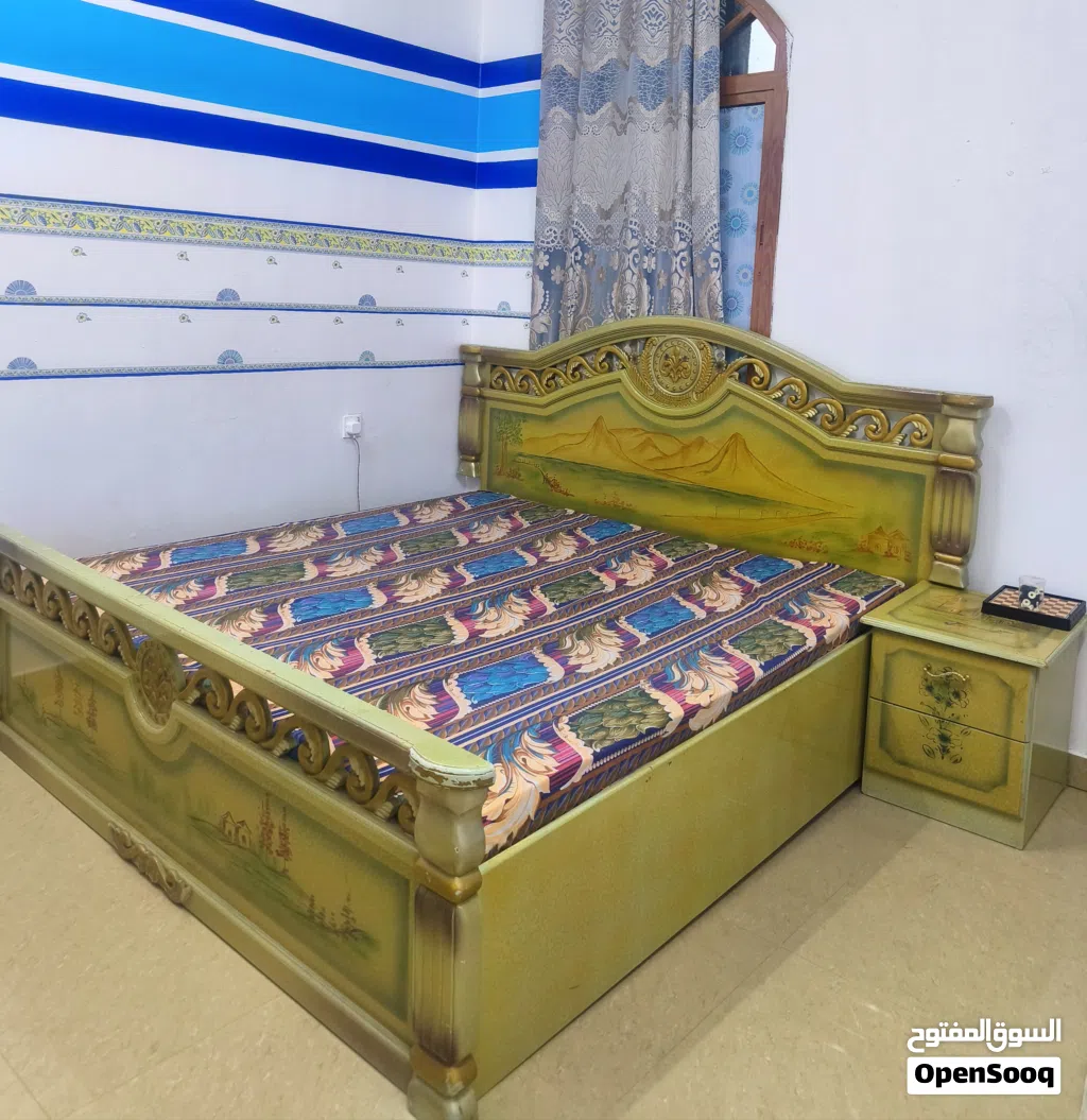 Bed, side table and two door wardrobe