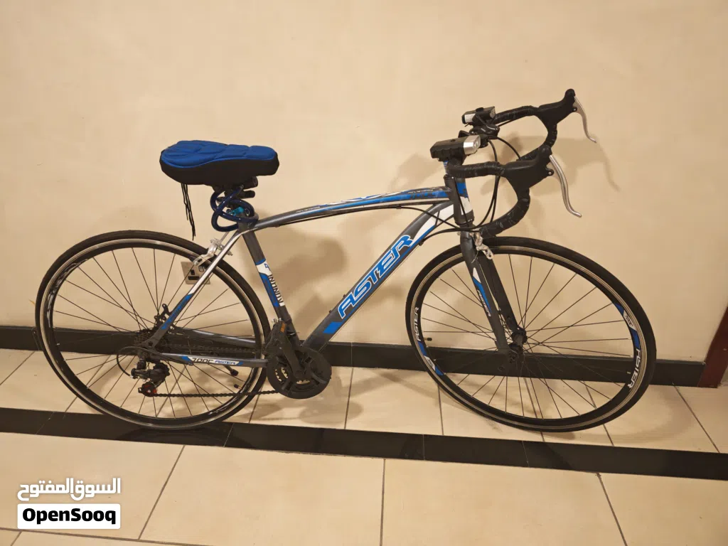 Used road bike - alloy frame with drop handlebars,