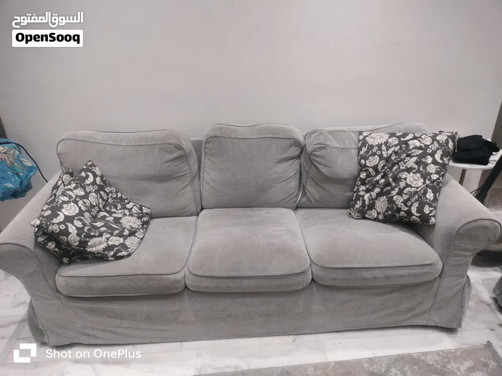 Ikea sofa well maintained with extra sofa cover