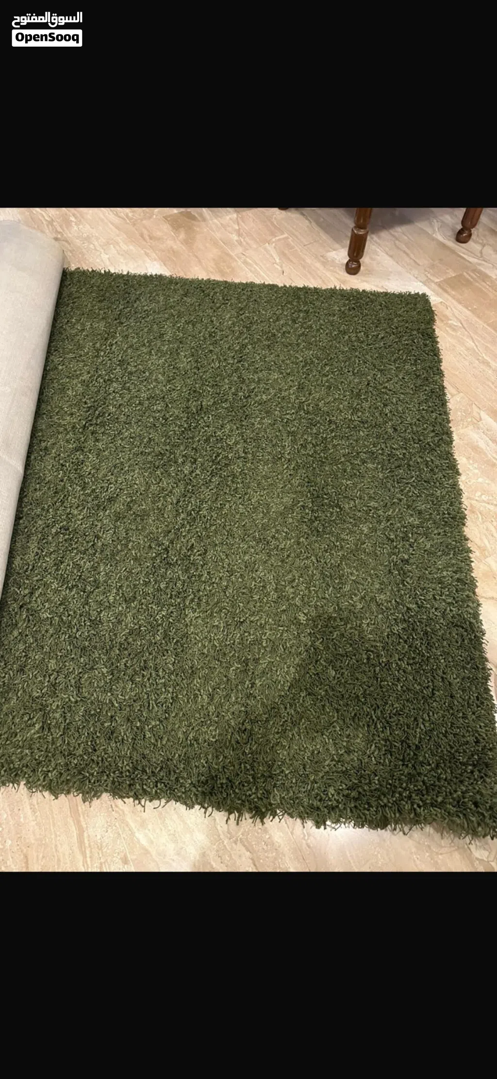 Dark green rug