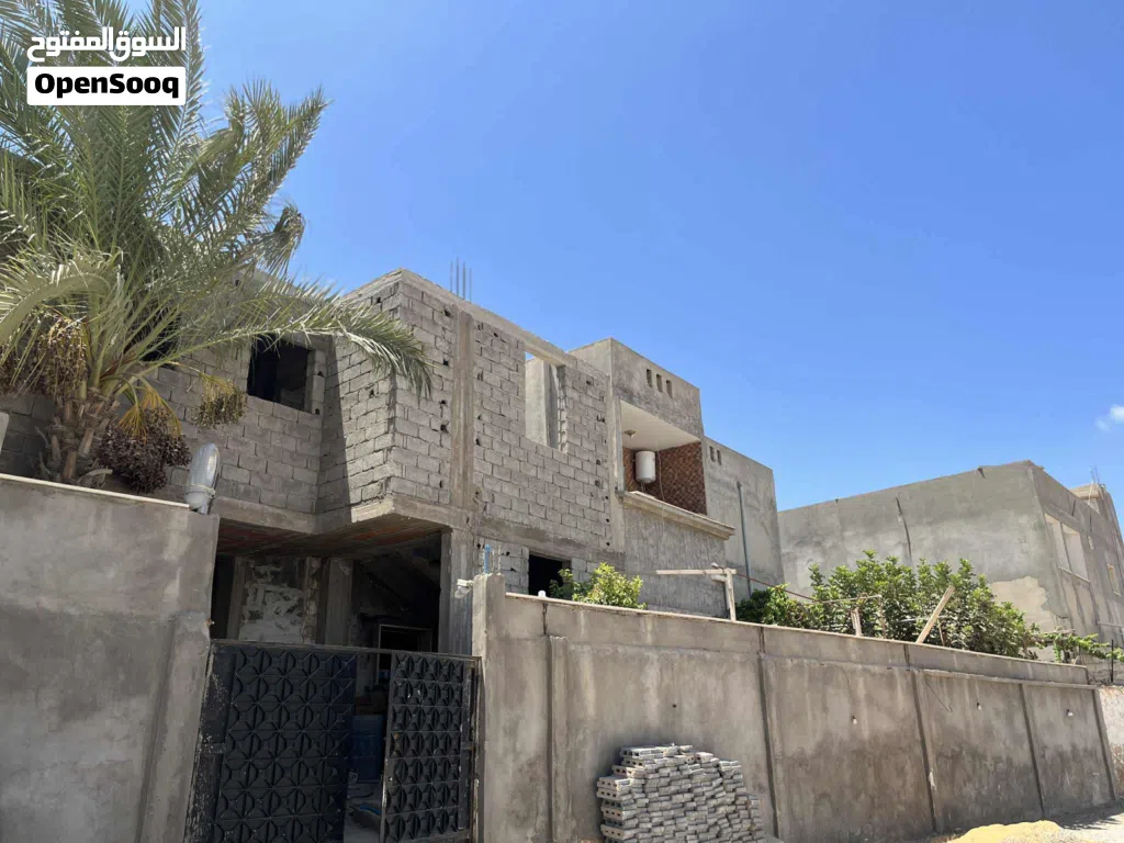 أرض 500 متر مقام عليها منزل دورين كاملات ومنزل هيكل مسقف قيد الانشاء جنان دور الداير واجهة 27متر