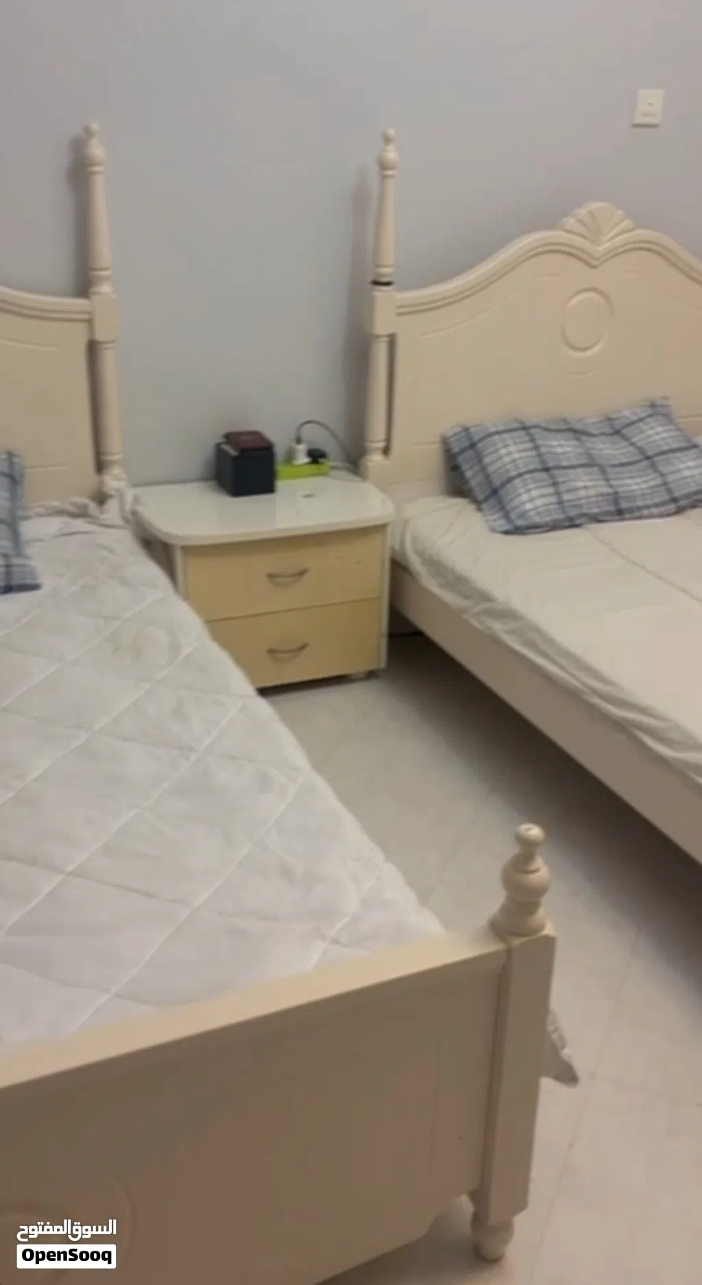 Two single beds with mattresses and bedside table (cream finish)