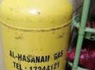 alhassanan gas cylinder with regulator and pipe half gas in cylinder