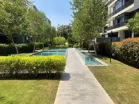 شقة متشطبة للبيع داخل كومباوند water way في التجمع الخامس بجوار الجامعة الأمريكية