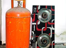 سلندر غاز حجم كبير + بوتاجاز 2 شعله + منظم سفتى  مع البايب  Large gas cylinder + 2-burner stove + sa