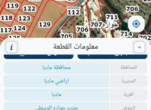 ارض للبيع 1005م² من المالك في مادبا (حوارة) عن جسر المطار 9 كم واصل جميع الخدمات اقساط لمدة 36 شهر