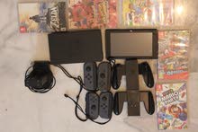 Nintendo switch with two extra joystick one extra charger and 5  games