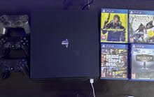 PS4 pro 1000gb with 5 games and 3 controllers